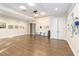Spacious community room featuring neutral walls, art displays, and doorway access at 8224 Simpson Falls Ct # 8224, Sarasota, FL 34243