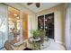 Cozy Florida room with glass table and chairs offers views of the living area at 8224 Simpson Falls Ct # 8224, Sarasota, FL 34243