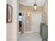 Inviting foyer with tile flooring, stylish lighting, and access to the office at 8224 Simpson Falls Ct # 8224, Sarasota, FL 34243