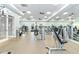 Bright gym featuring modern exercise equipment, ceiling fans, and mirrored wall at 8224 Simpson Falls Ct # 8224, Sarasota, FL 34243