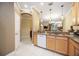 Kitchen area featuring a sink, countertop, and view to the dining and living room at 8224 Simpson Falls Ct # 8224, Sarasota, FL 34243