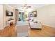 Bright living room featuring hardwood floors, comfortable seating, and sliding glass doors to lanai at 8224 Simpson Falls Ct # 8224, Sarasota, FL 34243