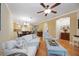 Spacious living room featuring hardwood floors, comfortable seating, and an open layout at 8224 Simpson Falls Ct # 8224, Sarasota, FL 34243