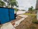 Backyard showcasing an outbuilding, a small patio, and a grill at 8409 43Rd W Ave, Bradenton, FL 34209