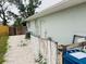 Backyard area of home with fencing, door, and air conditioning unit at 8409 43Rd W Ave, Bradenton, FL 34209