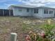 View of the back side of the home, showing the yard at 8409 43Rd W Ave, Bradenton, FL 34209