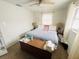 Spacious bedroom with ceiling fan, a cozy bed, and a bright window at 8409 43Rd W Ave, Bradenton, FL 34209