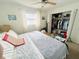 Bright bedroom features a ceiling fan, ample natural light, and a well-organized closet at 8409 43Rd W Ave, Bradenton, FL 34209