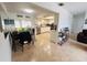 Cozy dining area adjacent to an open kitchen, featuring tile flooring and plenty of natural light at 8409 43Rd W Ave, Bradenton, FL 34209