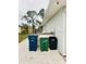 Exterior shot of the side of the house with trash and recycling bins at 8409 43Rd W Ave, Bradenton, FL 34209