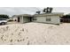 Charming single-story home with light blue exterior, featuring a rock garden and well-maintained yard at 8409 43Rd W Ave, Bradenton, FL 34209