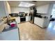 Modern kitchen with stainless steel appliances, white cabinets, and ample counter space at 8409 43Rd W Ave, Bradenton, FL 34209