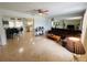 Open-concept living room with tile flooring and plenty of space, connecting to the dining area and kitchen at 8409 43Rd W Ave, Bradenton, FL 34209
