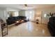 Spacious living room featuring a comfortable sectional sofa and tile flooring at 8409 43Rd W Ave, Bradenton, FL 34209