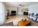 Bright living room with neutral tile flooring, large windows, and comfortable seating area at 8409 43Rd W Ave, Bradenton, FL 34209