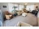 Spacious sunroom featuring ample seating, neutral carpet, and large windows for natural light at 8409 43Rd W Ave, Bradenton, FL 34209