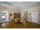 Well-lit community room with a reading area, a game table, and easy access to the outside at 915 Sw Barclay Ct, Venice, FL 34293