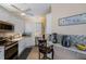Bright kitchen featuring white cabinets, stainless steel appliances, and tiled backsplash for a clean and modern look at 915 Sw Barclay Ct, Venice, FL 34293