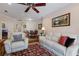 Inviting living room features comfortable seating, stylish decor, and an open layout connecting to the dining area at 915 Sw Barclay Ct, Venice, FL 34293