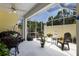 Bright and airy screened patio with comfortable seating, perfect for enjoying the outdoors at 915 Sw Barclay Ct, Venice, FL 34293
