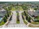 Aerial view of a well-maintained community with palm-lined streets, green spaces, and manicured landscaping at 11194 Spring Point Cir, Riverview, FL 33579