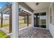 Step onto the backyard patio with pergola, ideal for enjoying outdoor dining and entertaining with access to sliding glass door at 11194 Spring Point Cir, Riverview, FL 33579