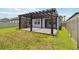Enjoy this lovely backyard featuring a pergola covered patio perfect for outdoor dining and entertaining at 11194 Spring Point Cir, Riverview, FL 33579