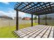 Relax on the backyard patio with pergola in a serene setting, ideal for enjoying outdoor living and entertaining at 11194 Spring Point Cir, Riverview, FL 33579