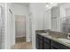 Bathroom featuring a double sink vanity, granite countertop, and a walk-in shower at 11194 Spring Point Cir, Riverview, FL 33579