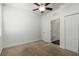 Bright bedroom with a ceiling fan, carpet flooring, and a closet at 11194 Spring Point Cir, Riverview, FL 33579