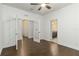Bedroom with hardwood flooring, ceiling fan, and access to bathroom at 11194 Spring Point Cir, Riverview, FL 33579