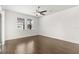 Bedroom featuring hardwood floors, neutral paint, ceiling fan, and natural light at 11194 Spring Point Cir, Riverview, FL 33579