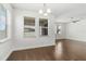 Dining room featuring hardwood floors, natural light, and modern lighting fixture at 11194 Spring Point Cir, Riverview, FL 33579