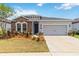 Charming single-story home with stone accents, a two-car garage, and well-maintained landscaping at 11194 Spring Point Cir, Riverview, FL 33579