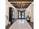 Grand foyer featuring tiled floors, high ceilings with beams, decorative lighting, and elegant furnishings at 11194 Spring Point Cir, Riverview, FL 33579