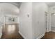 Hallway showcasing hardwood flooring and neutral paint at 11194 Spring Point Cir, Riverview, FL 33579