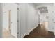 Bright hallway with hardwood floors and modern white trim at 11194 Spring Point Cir, Riverview, FL 33579