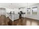 Modern kitchen featuring stainless steel appliances, gray backsplash, an island, and a dining nook at 11194 Spring Point Cir, Riverview, FL 33579