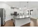 Bright kitchen features a large island, granite countertops, stainless appliances, and ample natural light at 11194 Spring Point Cir, Riverview, FL 33579
