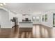 Bright, open-concept kitchen featuring an island, stainless steel appliances, and hardwood floors at 11194 Spring Point Cir, Riverview, FL 33579
