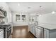 Contemporary kitchen featuring stainless steel appliances, a central island, and hardwood flooring at 11194 Spring Point Cir, Riverview, FL 33579