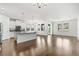 Spacious living room and kitchen combination featuring hardwood floors and plenty of natural light at 11194 Spring Point Cir, Riverview, FL 33579