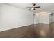 Spacious living room with hardwood floors, ceiling fan, and recessed lighting at 11194 Spring Point Cir, Riverview, FL 33579