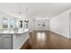 Bright living room and kitchen combo, featuring hardwood floors and ample windows at 11194 Spring Point Cir, Riverview, FL 33579