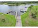 Stunning aerial view showcasing the boat docks and serene lakefront living at the property at 1015 143Rd Ne St, Bradenton, FL 34212
