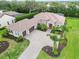 Spacious home features lush landscaping, paver driveway, a tile roof and a three-car garage at 1015 143Rd Ne St, Bradenton, FL 34212