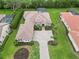 Home with manicured landscaping, paver driveway, tile roof, and stone accents on the facade at 1015 143Rd Ne St, Bradenton, FL 34212