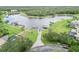 Aerial view of a property on a lake with a boat dock at 1015 143Rd Ne St, Bradenton, FL 34212