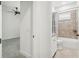 Bathroom with white vanity and shower-tub combo featuring decorative tile at 1015 143Rd Ne St, Bradenton, FL 34212