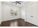 Bedroom with hardwood floors, large closet, and plantation shutters at 1015 143Rd Ne St, Bradenton, FL 34212